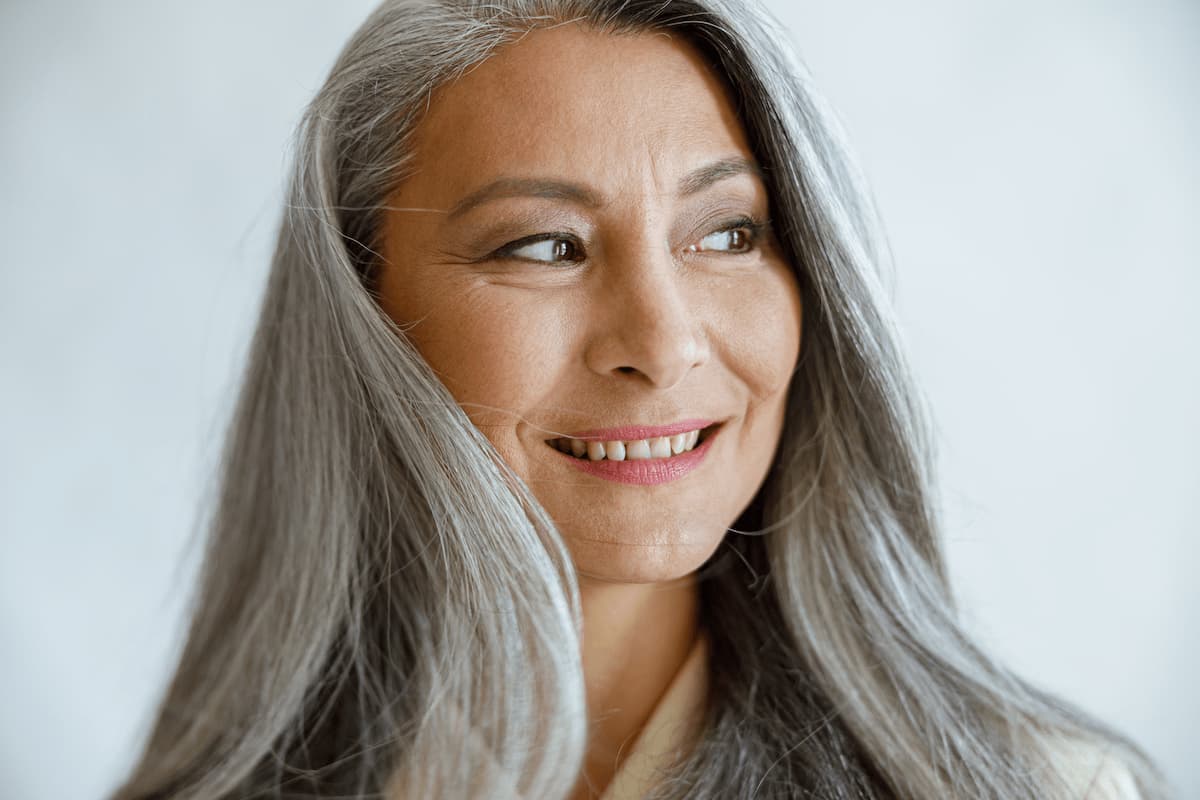 asian lady with loose grey hair poses for camera o 2024 10 18 08 11 15 utc 1