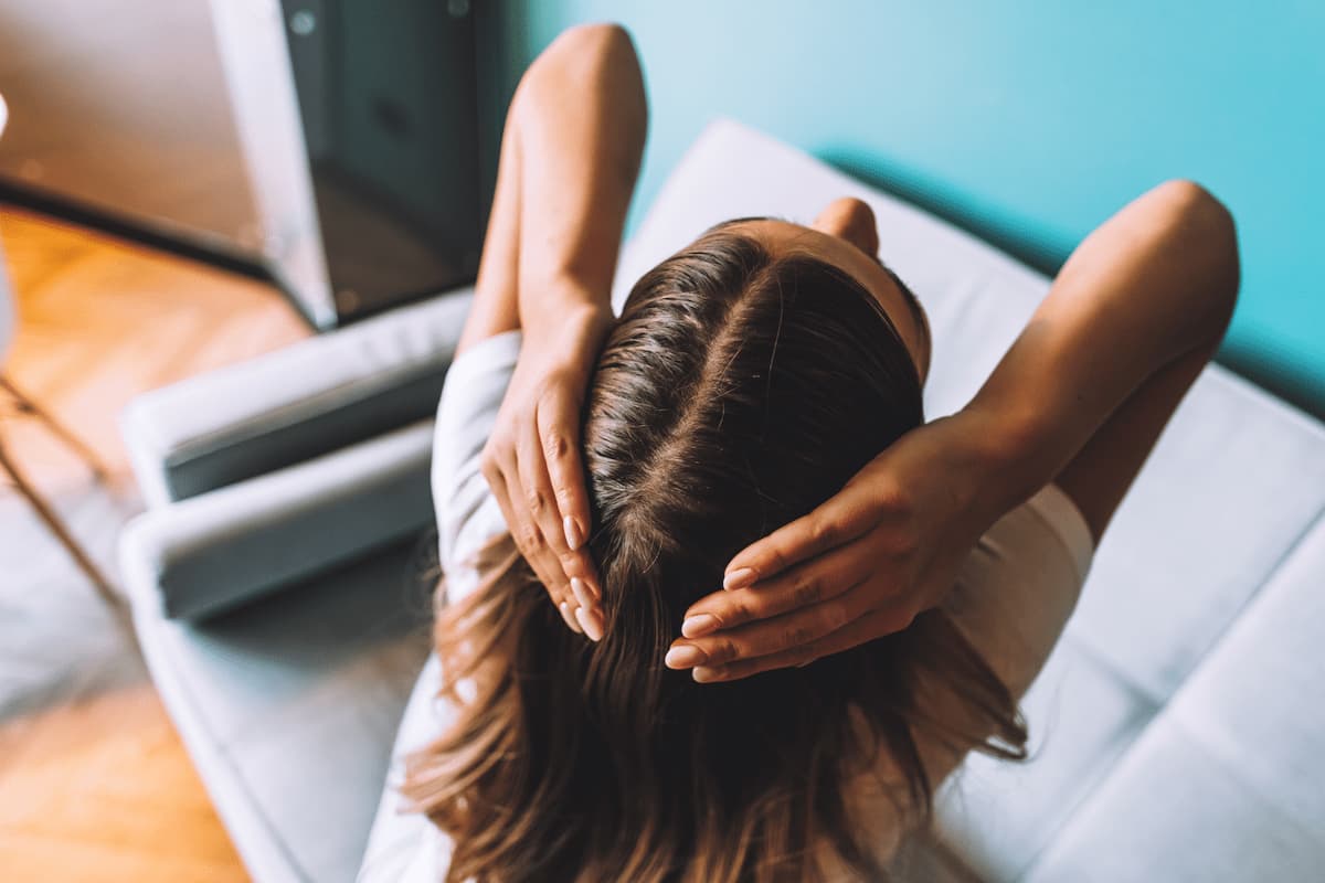 brunette woman showing her scalp hair roots colo 2024 11 27 23 19 37 utc 1