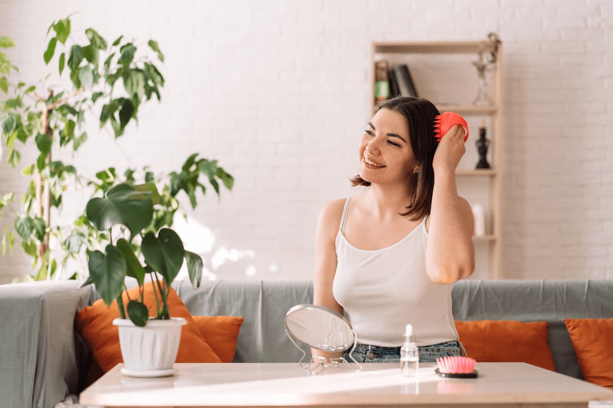 woman sitting on couch gives herself head massage 2023 11 27 04 55 23 utc 1